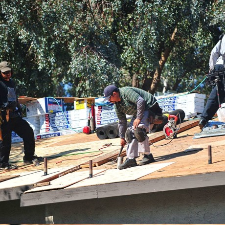 Aerial view of Edgeline Roofing repairing a residential rooftop
