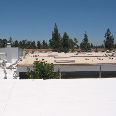 White silicone roofing installed on building