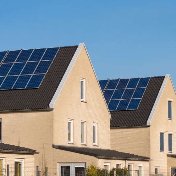 White EDPM roofing being installed on building